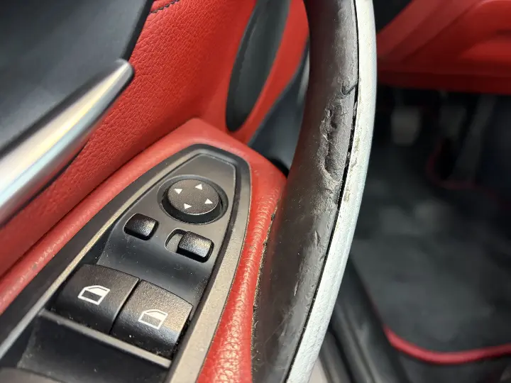 Sticky BMW interior door handle before replacement