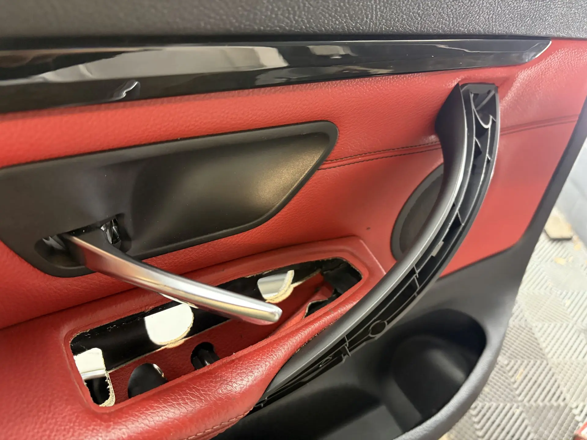 New BMW door handle fixed with self-tapping screws and body washers